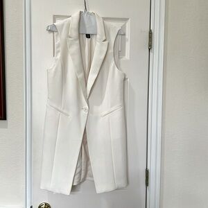 White House, black market Stylish White Sleeveless vest.